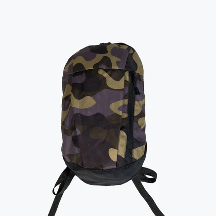 An orange painted blue, cut in half laying on a blue background